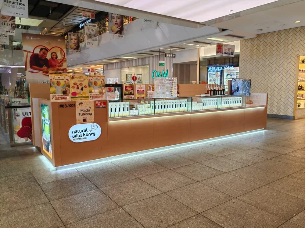 Natural Wild Honey shop with bottled honey displayed at the counter